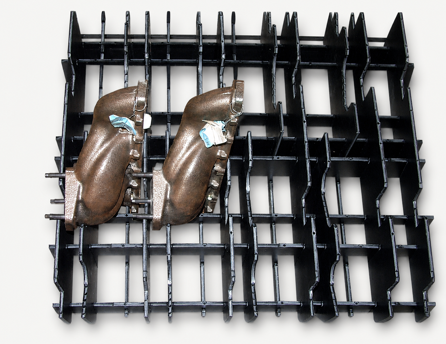 Solid-HDPE partition matrix supporting cast metal components