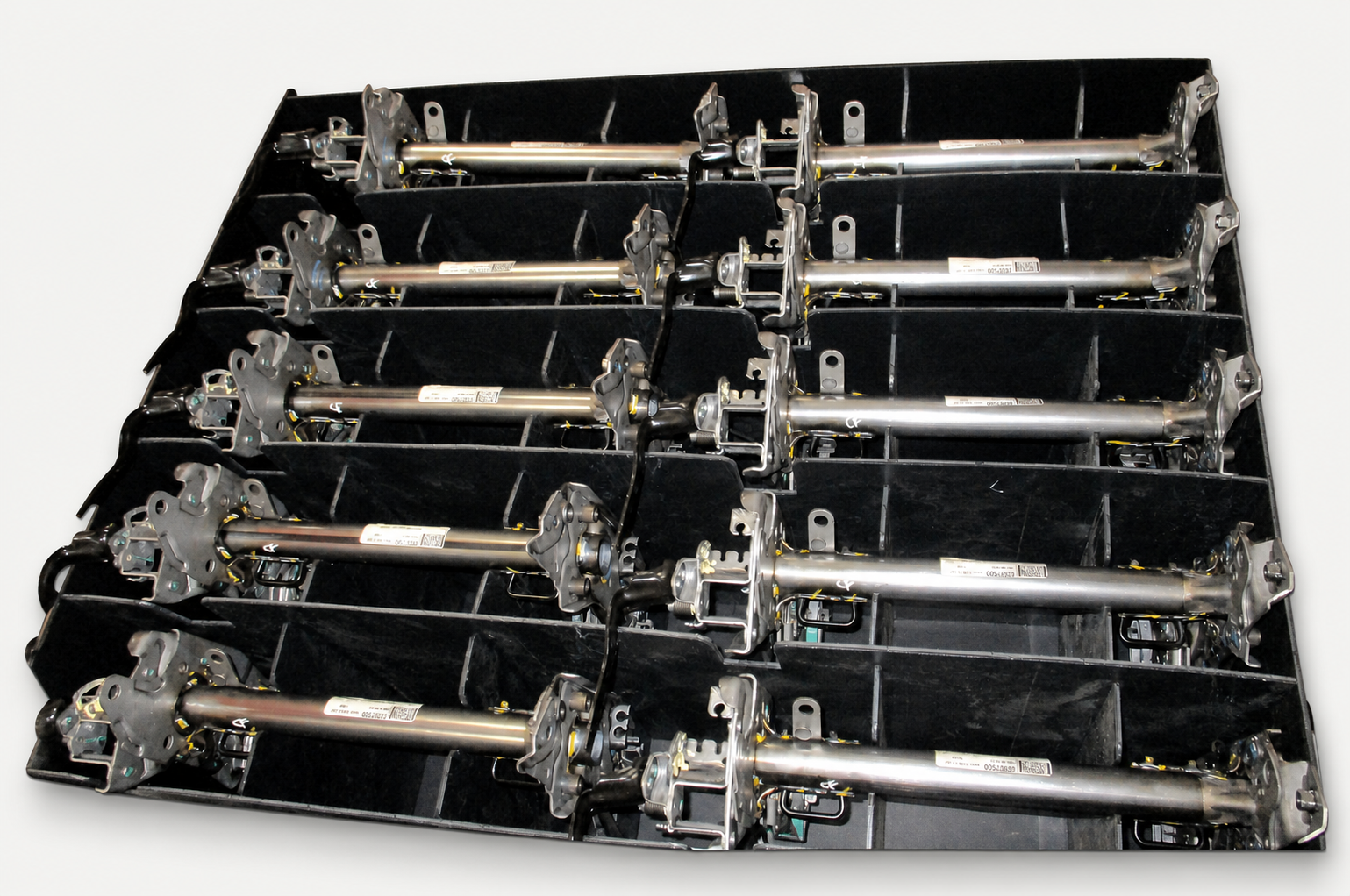 Custom partition system holding long metal assemblies in a returnable container