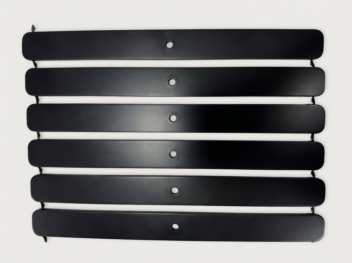 Six identical black HDPE strips with rounded ends, each with a single centered round hole